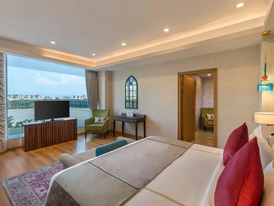 hotel near knowledge park ii greater noida — ExpoInn Suites and Convention business-ready room interior with workspace and professional setup