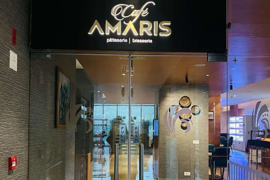 Entrance of Café Amaris at ExpoInn Suites and Conventions, a relaxed café space at a luxury hotel in Greater Noida
