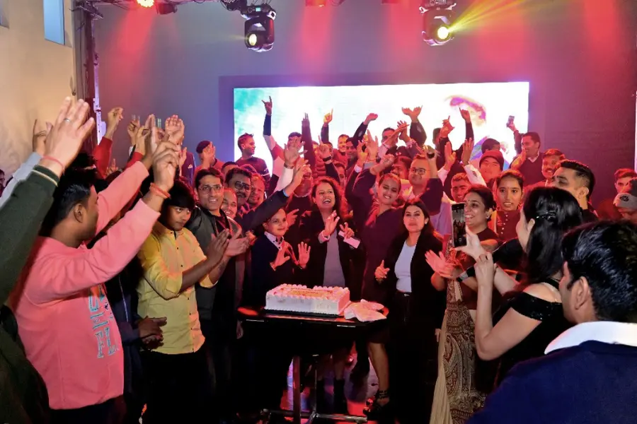 Event celebration  at ExpoInn with tables, chairs, and minimal décor.