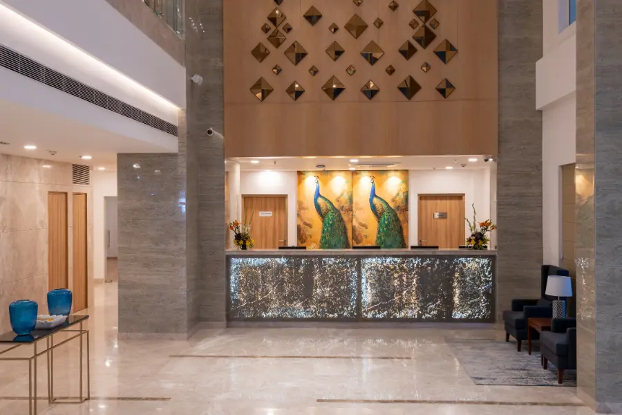 exhibition hotel in greater noida booking — ExpoInn Suites and Convention lobby or reception with welcoming staff