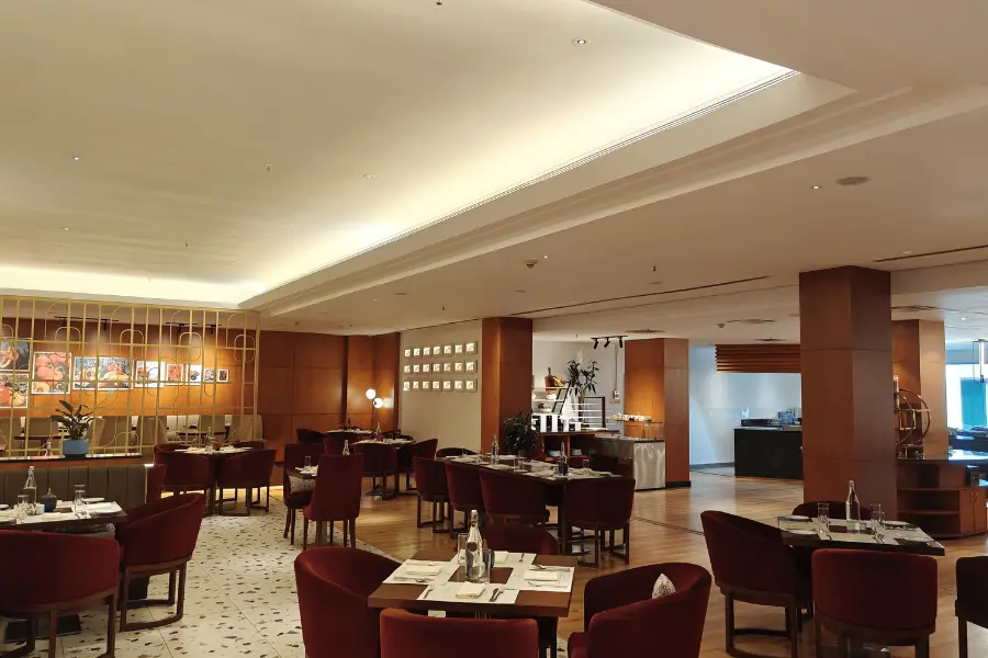 Elegant hotel dining area with refined seating and warm ambience at ExpoInn, one of the luxury hotels in Greater Noida