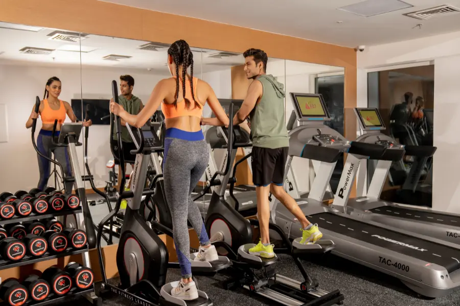 Wellness and gym facilities at ExpoInn with treadmills and weights