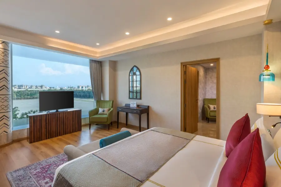 Spacious deluxe room at ExpoInn featuring elegant décor and ambient lighting