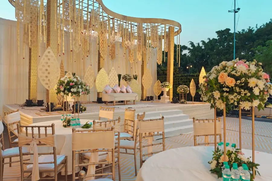 ExpoInn wedding venue decorated with lights, flowers, and a grand stage setup.